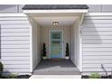 Welcoming entrance with a vibrant blue door, decorative plants, and covered porch at 1251 Pierce Ave, Smyrna, GA 30080