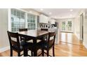 Cozy dining area with a wooden table set, adjacent to the bright, updated kitchen at 361 Adelle Se St, Atlanta, GA 30315