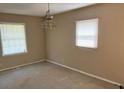 A bedroom with two windows and carpeted floors at 1487 Colony East Cir, Stone Mountain, GA 30083