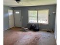 A living room with a window and a white front door at 1487 Colony East Cir, Stone Mountain, GA 30083