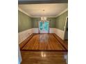 Elegant dining room featuring classic wainscoting and a chandelier at 1435 Great Oaks Dr, Lawrenceville, GA 30045