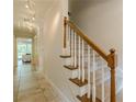 Staircase with carpet steps, wood trim and a tiled floor at 535 Brickleberry Ln, Roswell, GA 30075