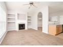 Bright open-concept living room with fireplace and easy access to the kitchen and dining area at 6010 Capitol Knl, Fairburn, GA 30213