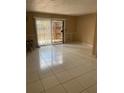 Open living room featuring tile flooring, sliding glass door and neutral paint at 1867 Myrtle Dr # 5, Atlanta, GA 30311