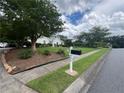 Exterior image shows a home's driveway with an American flag next to the mailbox at 333 Etoawha Vly, Woodstock, GA 30189