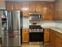 A well-equipped kitchen featuring stainless steel appliances and granite countertops at 333 Etoawha Vly, Woodstock, GA 30189
