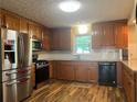 A well-equipped kitchen featuring stainless steel appliances and granite countertops at 333 Etoawha Vly, Woodstock, GA 30189