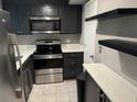 Modern kitchen with stainless steel appliances, dark cabinetry, and bright countertops at 1683 Briarcliff Ne Rd # 4, Atlanta, GA 30306