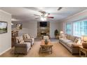 Inviting living room features a stone fireplace and large windows for ample natural light at 2047 Cliffton Ter, Snellville, GA 30039