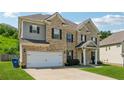 Beautiful two-story home boasts a spacious driveway and manicured front lawn at 3711 Wartrace Dr, Atlanta, GA 30331
