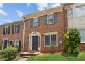 Attractive brick facade with complementary shutters enhancing the curb appeal of the townhome at 573 Hambrick Sq, Stone Mountain, GA 30083
