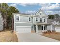 Charming two-story home with a manicured lawn and a welcoming front porch at 251 Arnewood Cir, Mcdonough, GA 30253