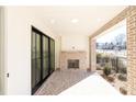 Cozy covered brick porch with a fireplace, perfect for outdoor relaxation at 362 Olmstead Way # 23, Alpharetta, GA 30022