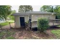 A fenced backyard featuring a wooden deck perfect for outdoor entertaining at 1829 Goddard Se St, Atlanta, GA 30315