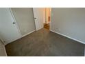 Cozy bedroom with neutral carpet and ample closet space at 1829 Goddard Se St, Atlanta, GA 30315