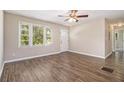 Bright living room featuring hardwood floors, neutral walls, and ample natural light at 1829 Goddard Se St, Atlanta, GA 30315