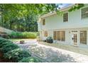 Enjoy a stone patio and a fenced-in backyard perfect for entertaining or relaxing by the fire pit at 1241 Newbridge Trce, Brookhaven, GA 30319