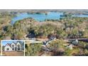 An aerial view of a lakefront community showcasing lush trees, new homes, and lake views at 3735 Tamiami Trl, Cumming, GA 30041