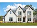 Beautiful two-story home featuring brick accents and a well-kept front lawn at 3735 Tamiami Trl, Cumming, GA 30041
