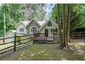 Charming home featuring unique stone accents, with a fenced yard at 835 Timber Lake Trl, Cumming, GA 30041