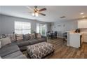 Open-concept living and dining area with stylish furniture and natural light at 183 Venture Path, Hiram, GA 30141