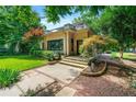 Inviting home exterior featuring manicured lawn, decorative trees, and a brick facade at 1181 Fairview Ne Rd, Atlanta, GA 30306