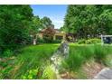 Lush landscaping and a large rock accent the exterior of this attractive property at 1181 Fairview Ne Rd, Atlanta, GA 30306