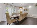Elegant dining room features a grand table, chandelier, and natural light at 2896 Tiffany Cir, Lawrenceville, GA 30044