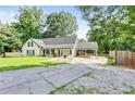 Charming home with a long driveway and a well-maintained, expansive front yard at 2896 Tiffany Cir, Lawrenceville, GA 30044