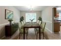 Dining area with natural light, neutral walls, and a stylish table for eight at 260 Redding Rdg, Atlanta, GA 30349