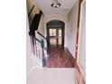 Inviting foyer with hardwood floors and staircase leading to the upper level at 3645 Mcclaren Way, Lawrenceville, GA 30044