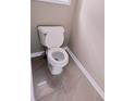 Clean half bathroom featuring a toilet and neutral wall color at 3645 Mcclaren Way, Lawrenceville, GA 30044