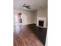 Spacious living room with hardwood floors, fireplace, and ample natural light at 3645 Mcclaren Way, Lawrenceville, GA 30044