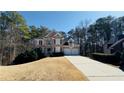 Charming two-story home with well-kept lawn, a driveway, and a two-car attached garage at 4569 Campenille Trce, Suwanee, GA 30024