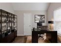 Functional home office with sleek desk, shelving, and natural light, creating an ideal workspace at 4185 Post Oak Grv, Atlanta, GA 30349