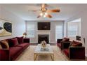 Inviting living room with fireplace, plush seating, and modern decor, ideal for relaxation and entertaining at 4185 Post Oak Grv, Atlanta, GA 30349