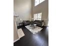 Spacious living room features high ceilings, dark hardwood floors, and neutral decor at 1643 Jackson Nw Way, Atlanta, GA 30318
