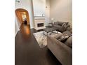 Open-concept living room with fireplace and hardwood floors at 1643 Jackson Nw Way, Atlanta, GA 30318
