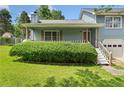 Charming one story section of home with trimmed hedges along the front porch at 58 6Th W Ave, Dallas, GA 30157