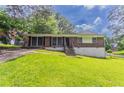 Charming brick home with a lush green lawn, offering a welcoming curb appeal at 4337 Brookside Dr, Forest Park, GA 30297