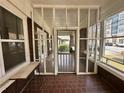 Enclosed porch with brick floor featuring lots of natural light at 472 Parkway Ne Dr, Atlanta, GA 30308