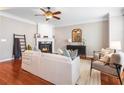Inviting living room features hardwood floors, fireplace, and comfortable seating at 7863 Kiverton Pl, Atlanta, GA 30350