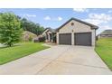 Beautiful home featuring a spacious driveway and attached two-car garage at 80 Pulaski Pl, Jonesboro, GA 30238