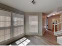 Bright living room featuring large windows, light gray walls, and light vinyl plank flooring at 3637 Chinaberry Ln, Snellville, GA 30039