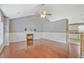 Open-concept living room with fireplace and hardwood flooring at 375 Shadetree Ln, Lawrenceville, GA 30044