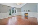 Spacious living room featuring a fireplace and large windows at 375 Shadetree Ln, Lawrenceville, GA 30044