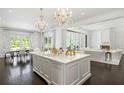 Bright, open kitchen with large island, modern chandeliers, and high-end finishes at 1640 Kenai Rd, Kennesaw, GA 30152
