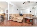 Spacious living room boasts a comfortable leather sectional, wood floors, and ample natural light, perfect for Gathering gatherings at 737 Wilkes Dr, Loganville, GA 30052