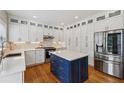 Modern kitchen boasts custom cabinets, stainless steel appliances, and center island at 2508 Haddenham Sw Ln, Smyrna, GA 30082