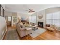 Inviting living room with fireplace, hardwood floors, and lots of natural light at 2508 Haddenham Sw Ln, Smyrna, GA 30082